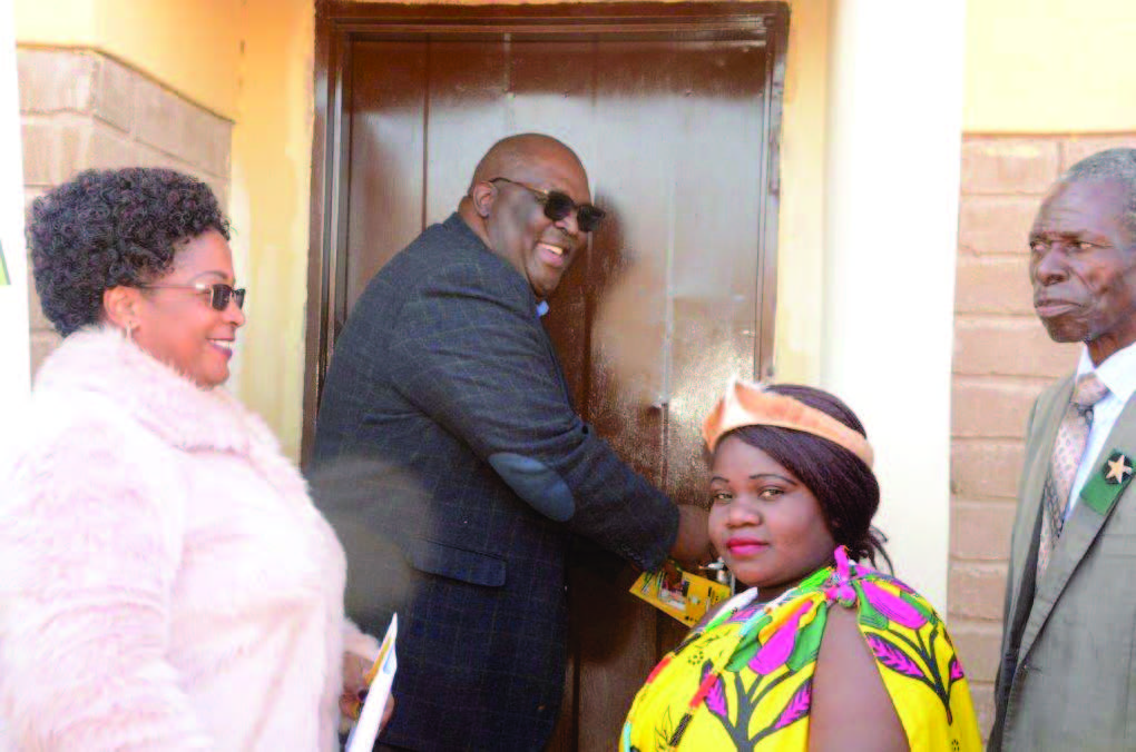 MEC Jerry Ndou and Collins Chabane mayor Joyce Bila are in a happy mood as they hand over a house to Confidence Ngobeni at Majosi recently. Next to them is chief Majosi.