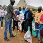 Collins Chabane mayor Moses Maluleke handing over food parcels at Shihosana on Wednesday