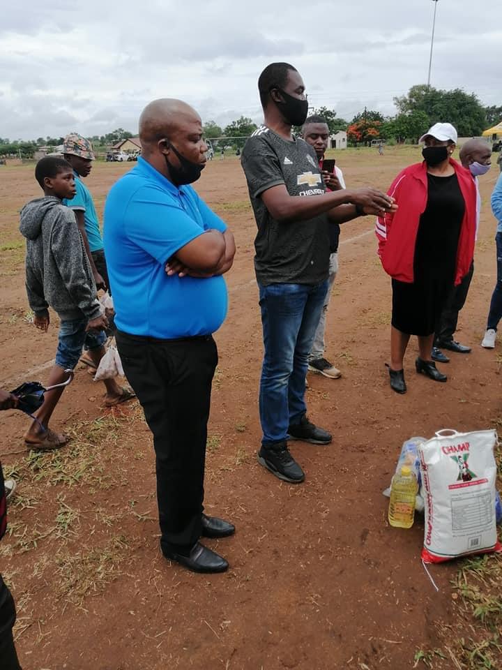 Mavikane(left) with Collins Chabane Local Municipality mayor Moses Maluleke at the giving of food parcels to communities