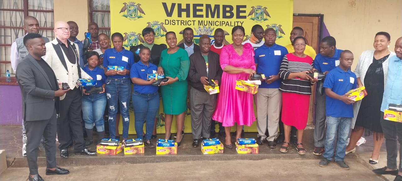 Vhembe Executive mayor with fellow councillors give pairs of shoes and sanitary towels to learners at Mhinga Special school